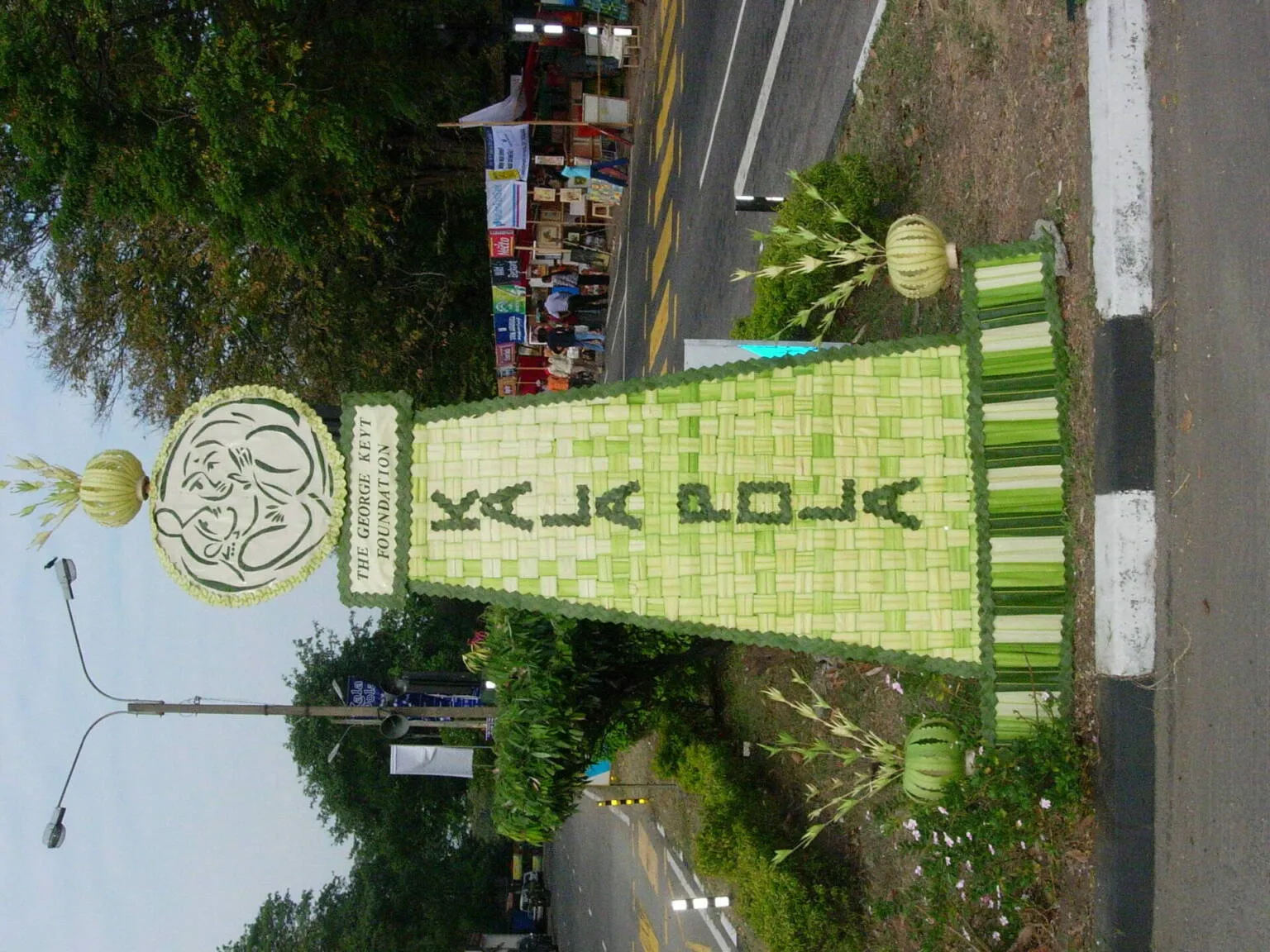 A large green sign displaying the words "Kalapola" prominently in bold letters.