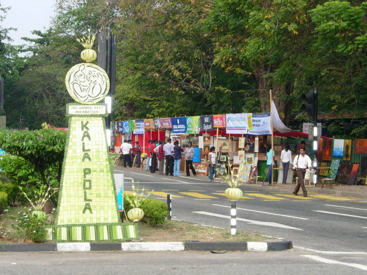 A tower featuring a visible sign, highlighting its design and timekeeping function in a scenic setting.
